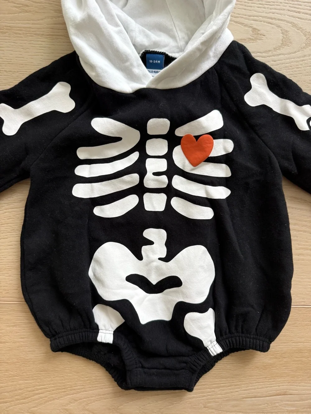 Old Navy Black and White Skeleton Hoodie Romper with Orange Heart
